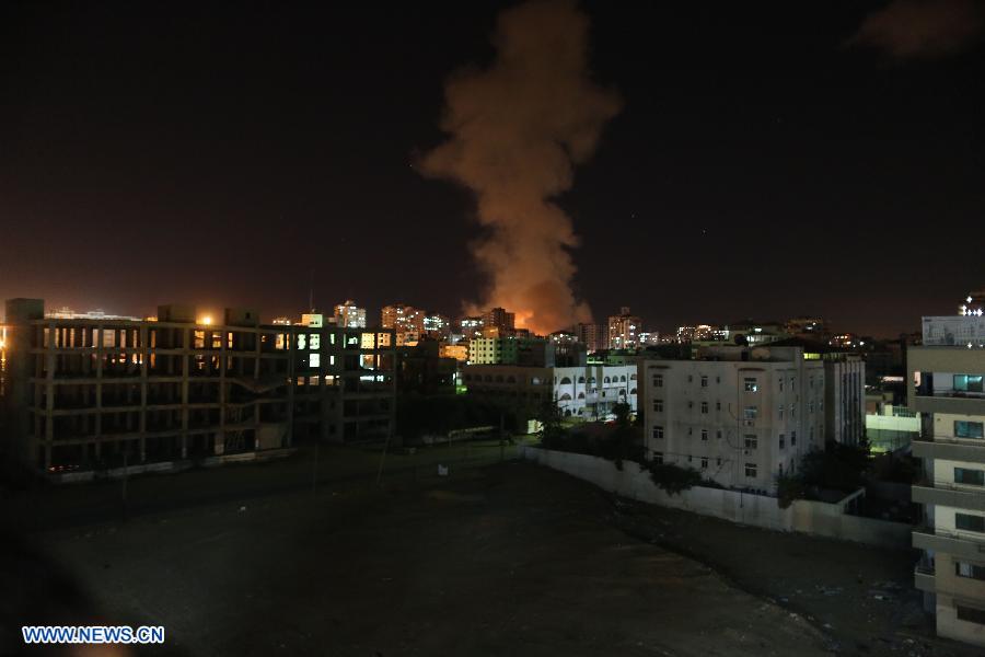 Smoke rises following an Israeli airstrike in Gaza City, on Nov. 14, 2012. Palestinian witnesses said Israeli airstrikes had hit a series of targets across Gaza City, shortly after the assassination of the top Hamas commander. Hamas security officials said that two Hamas training facilities were among the targets. (Xinhua/Wissam Nassar)