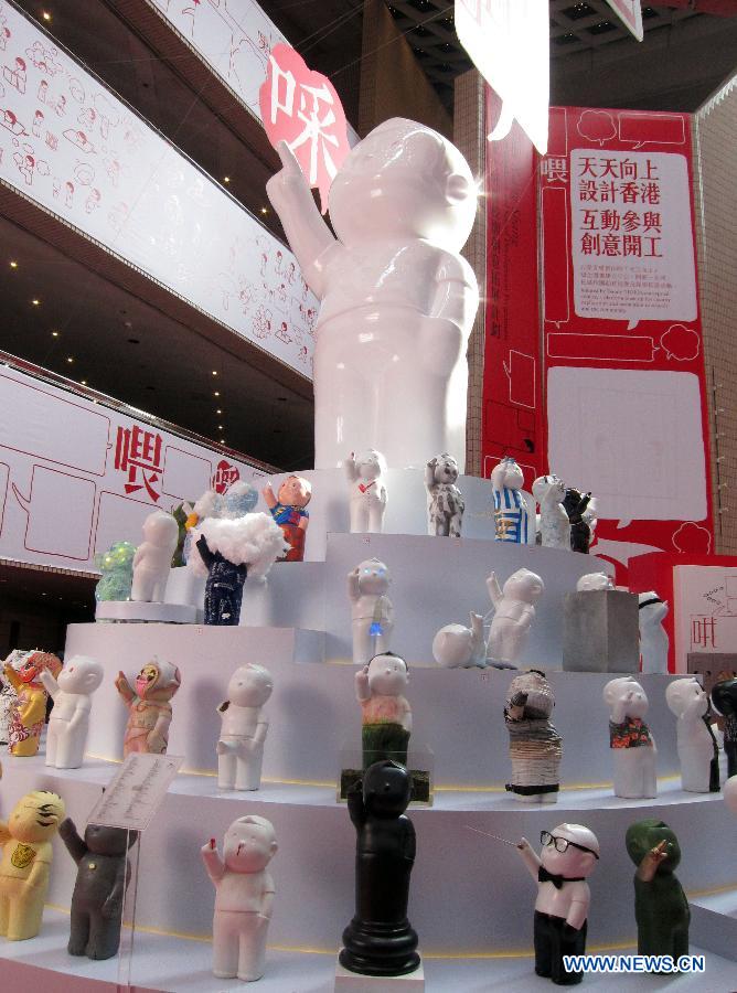 Photo taken on Nov. 14, 2012 shows sculpture works during a creative sculpture exhibition held in Hong Kong, south China. The theme of the exhibition was initiated by conceptual comics of Hong Kong artist Danny Yung. (Xinhua/Zhao Yusi)
