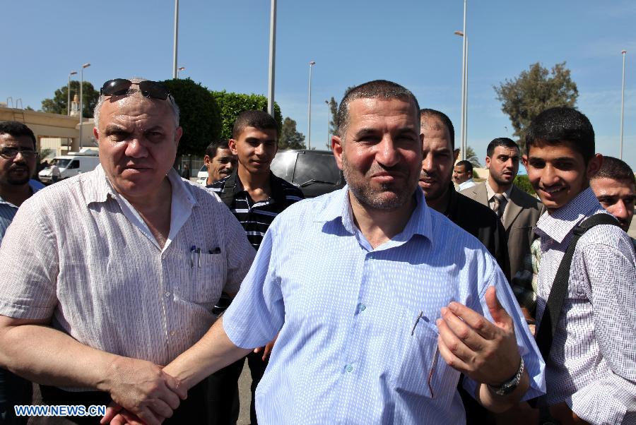 This file photo taken on Oct. 18, 2011 shows that Ahmed al-Jaabari (R, Front) poses for a picture after a prisoner swap deal was made between Hamas and Israel, at Rafah border in southern Gaza Strip. The head of the armed wing of Islamic Hamas movement, Ahmed al-Jaabari, was killed along with another escort in an Israeli airstrike on their car Wednesday afternoon in Gaza City, Hamas and medical sources said. (Xinhua/Wissam Nassar)