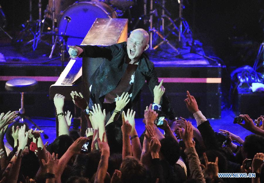 Isaac Slade, lead vocals and piano of American piano rock band "The Fray", performs during a concert at Tango Club in Beijing, capital of China, Nov. 14, 2012. The band was formed in 2002 and featured by the use of the piano as the lead instrument in their music. (Xinhua/Xiao Xiao)