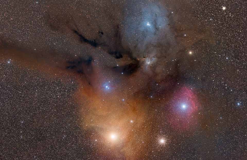 Colorful Clouds Near Rho Ophiuchi. Fine dust illuminated from the front by starlight produces blue reflection nebulae. Gaseous clouds whose atoms are excited by ultraviolet starlight produce reddish emission nebulae. (Photo/ NASA)