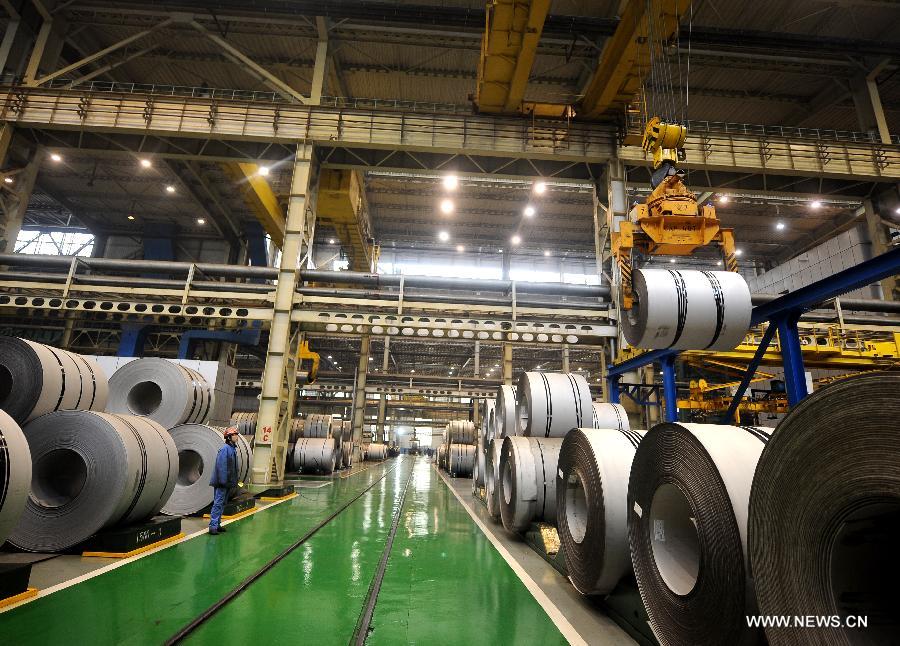 A worker directs lifting a stainless steel coil in Taiyuan Iron & Steel (Group) Company (TISCO) in Taiyuan, capital of north China's Shanxi Province, Nov. 15, 2012. Against the backdrop of sluggish steel industry, TISCO, the world's largest stainless steel enterprise, has optimized product structure with technical innovation, and managed to achieve revenue of 105.541 billion yuan (about 16.88 billion U.S. dollars) in the first three quarters of 2012, with a year-on-year growth rate of 11.4%. (Xinhua/Yan Yan) 