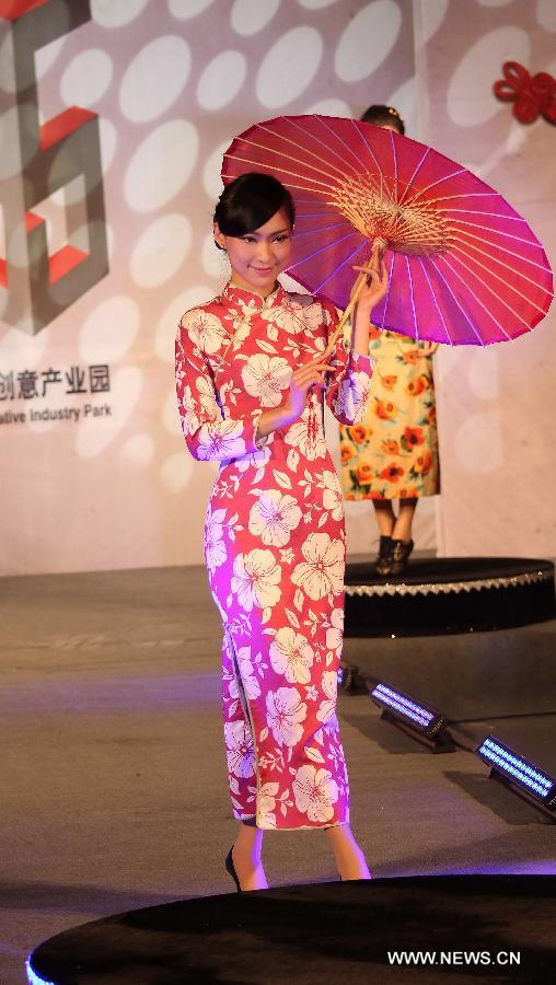 A model presents a cheongsam, a traditional Chinese women's dress also known as Qipao, at a cheongsam show in Nantong, east China's Jiangsu Province, Nov. 16, 2012. (Xinhua/Huang Zhe) 