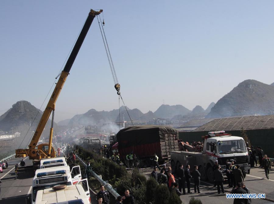 Photo taken on Nov. 17, 2012 shows a traffic accident site on the Shanghai-Kunming expressway in Anshun City, southwest China's Guizhou Province. The pileup accident occurred at about 9 a.m. Saturday on the expressway in Anshun City, leaving nine people dead and 19 others injured. More than 25 vehicles involved in the accident, and seven of them burst into flames. (Xinhua/Tao Xuede)