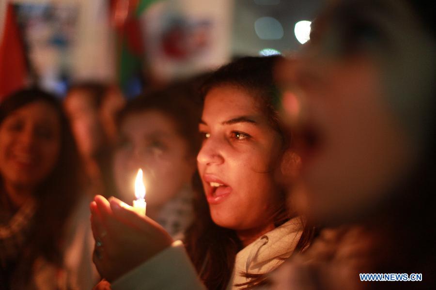 Palestinians take part in a rally against Israeli military operation in the Gaza Strip, in the West Bank city of Ramallah, on Nov. 19, 2012. (Xinhua/Fadi Arouri) 