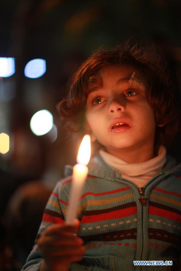 A Palestinian child takes part in a rally against Israeli military operation in the Gaza Strip, in the West Bank city of Ramallah, on Nov. 19, 2012. (Xinhua/Fadi Arouri)