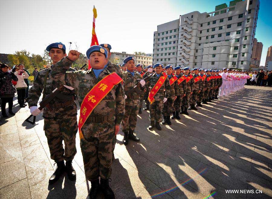 Members of the medical team of the 14th batch of Chinese peacekeeping force for Liberia swear during a departure ceremony in Tianjin, north China, Nov. 13, 2012. The first batch of a 43-member Chinese medical personnel group left for Liberia on a eight-month UN peacekeeping mission here on Tuesday. (Xinhua/Zhang Chaoqun) 