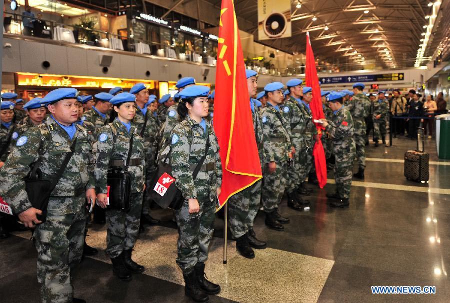 Members of the medical team of the 14th batch of Chinese peacekeeping force for Liberia prepare for departure at the Capital International Airport in Beijing, capital of China, Nov. 13, 2012. The first batch of a 43-member Chinese medical personnel group left for Liberia on a eight-month UN peacekeeping mission on Tuesday. (Xinhua/Zhang Chaoqun)