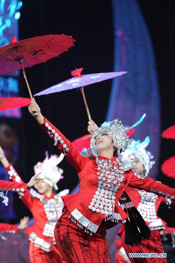 Dancers perform during a dancing show about the tradition of Miao and Dong ethnic groups in Kaili City of Qiandongnan, southwest China's Guizhou Province, Nov. 19, 2012. (Xinhua/Tao Liang) 
