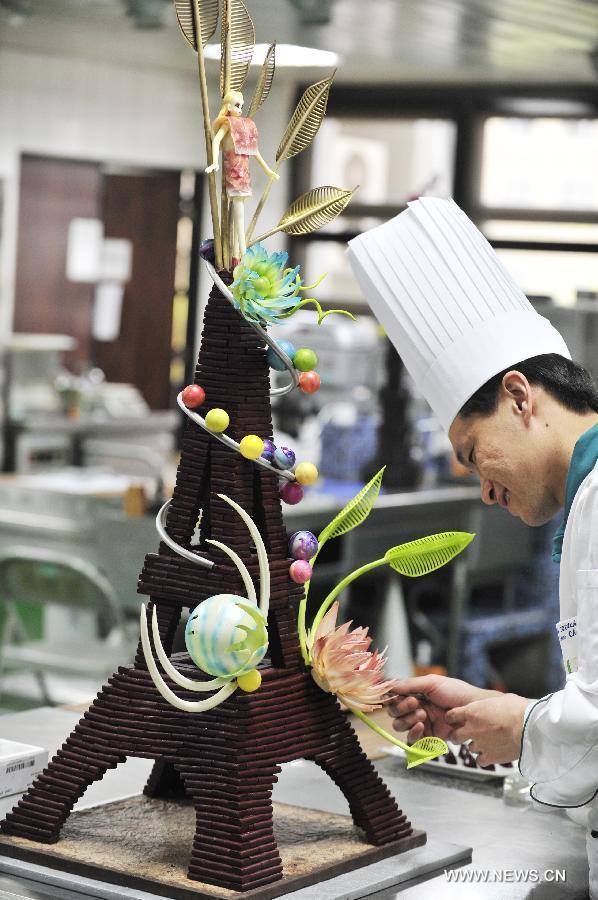 A contestant makes his creation at a qualifying test for the World Chocolate Masters (WCM) competition in Taipei, southeast China's Taiwan, Nov. 20, 2012. The winner of the qualifying test in Taiwan will also compete with counterparts from Chinese Mainland, Australia and Singapore in 2013, who will strive for the qualification within the scope of Asian-Pacific region to take part in the WCM competition. (Xinhua/Wu Ching-teng) 