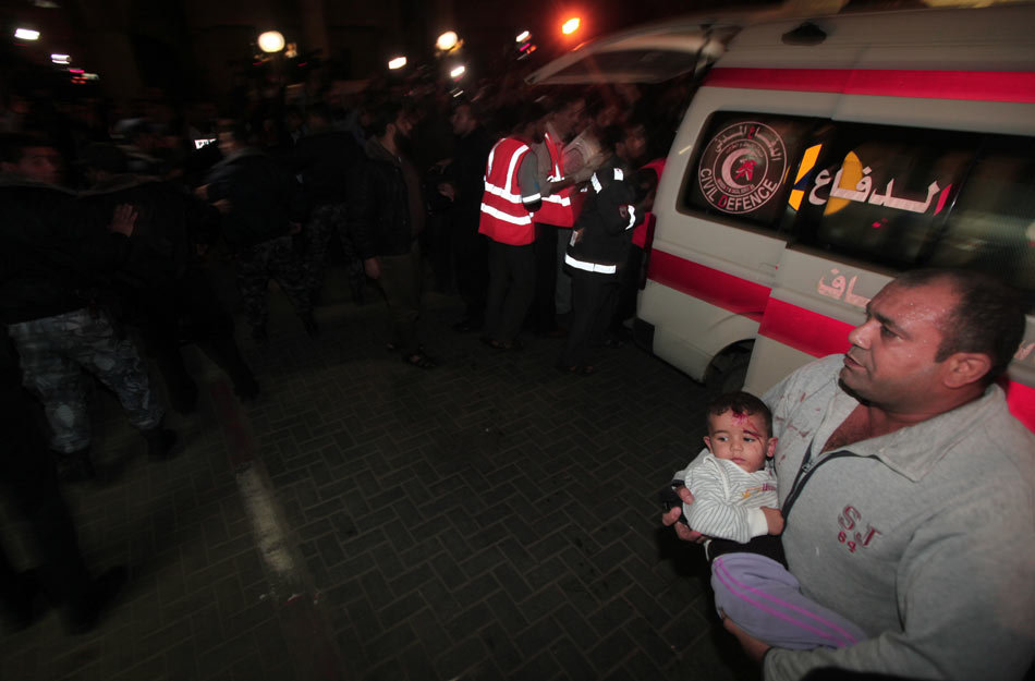 An injured child is sent to the hospital after an air strike in the Gaza Strip, on Nov. 15, 2012. (Xinhua/AFP)