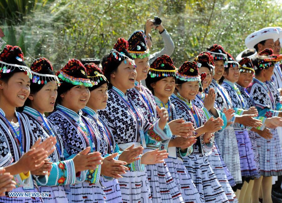 People of the Miao Ethnic Group perform at the first China Puer International Country Music Festival in Puer, southwest China's Yunnan Province, Nov. 21, 2012. The new silk road Miss World contest will also be held along with the festival, which kicked off here on Tuesday. (Xinhua/Yang Zongyou)