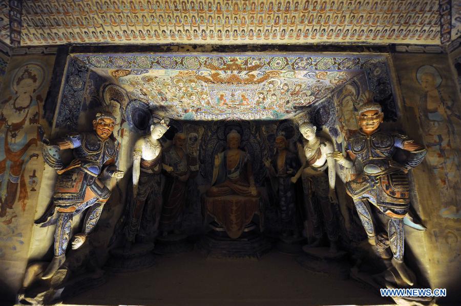 Photo taken on Nov. 20, 2012 shows the duplicate of an ancient cave at "The Colors of Dunhuang: A Magic Gateway to the Silk Road" exhibition held in Mimar Sinan University in Istanbul of Turkey. The Exhibition kicked off here on Tuesday. (Xinhua/Ma Yan) 