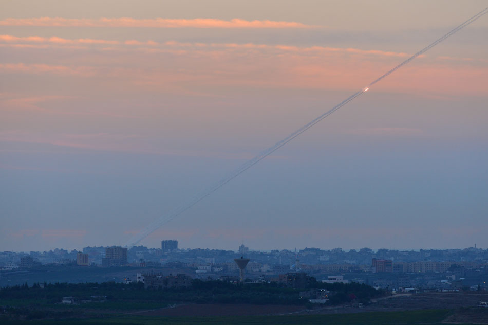 Vapor trails of rockets are seen in the Gaza Strip, on Nov. 15, 2012. (Xinhua/Yin Dongxun)