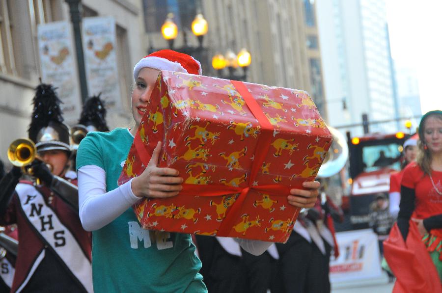 Performers march during the 2012 McDonald's Thanksgiving Parade in Chicago, the United States, Nov. 22, 2012. (Xinhua/Zhang Baoping)