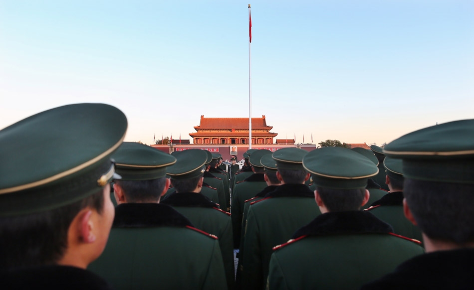 More than 400 Chinese armed policemen from Tian’anmen guard team attend the national flag rising ceremony on the Tian’anmen Square in Beijing on Nov. 23. It is the last time for them to attend national flag rising ceremony as soldiers as they will soon be discharged from active military service. (Xinhua/ Wan Xiang)