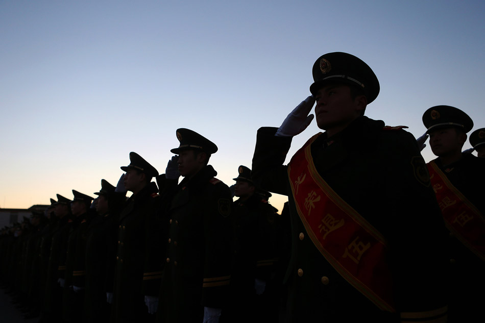 More than 400 Chinese armed policemen from Tian’anmen guard team attend the national flag rising ceremony on the Tian’anmen Square in Beijing on Nov. 23. It is the last time for them to attend national flag rising ceremony as soldiers as they will soon be discharged from active military service. (Xinhua/ Wan Xiang)