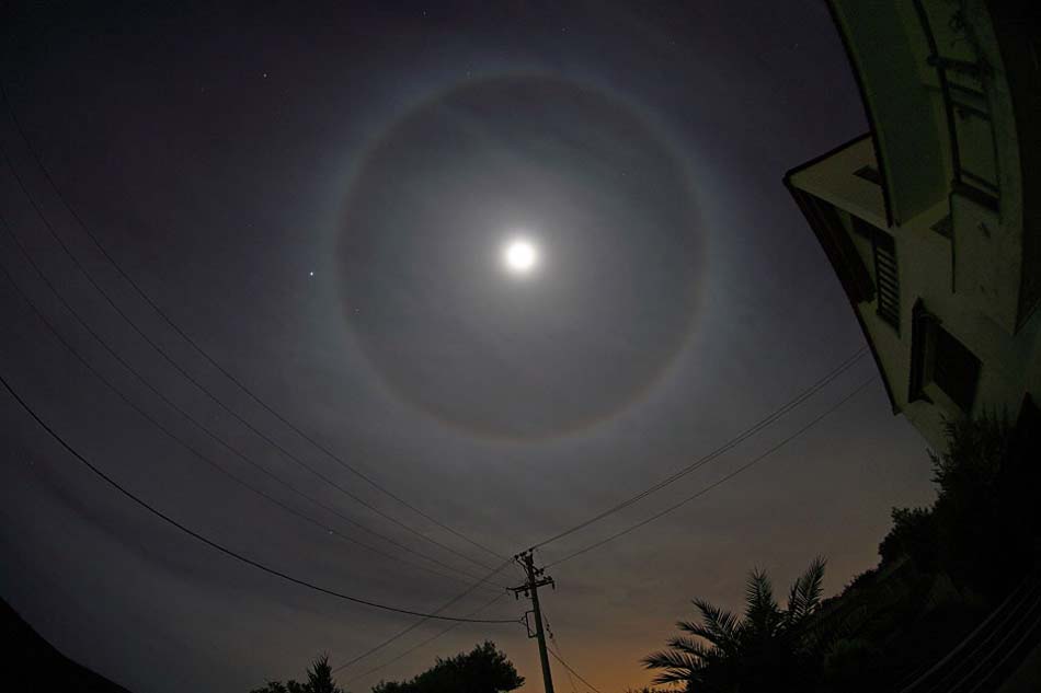 A Halo Around the Moon. This fairly common sight occurs when high thin clouds containing millions of tiny ice crystals cover much of the sky. Each ice crystal acts like a miniature lens. (Photo/ NASA)