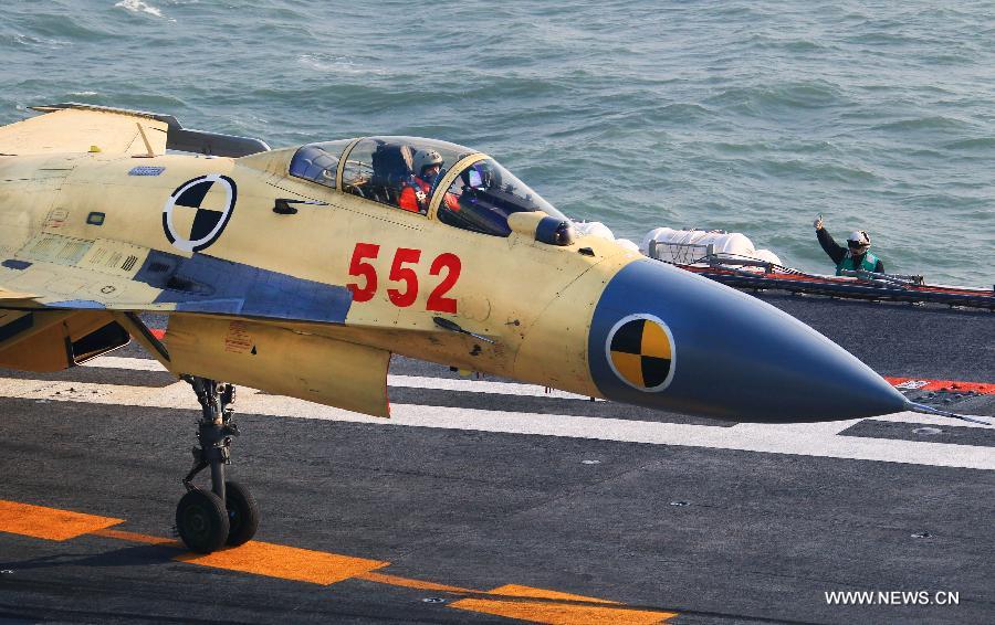 This undated photo shows a carrier-borne J-15 fighter jet ready to take off from China's first aircraft carrier, the Liaoning. (Xinhua/Zha Chunming) 