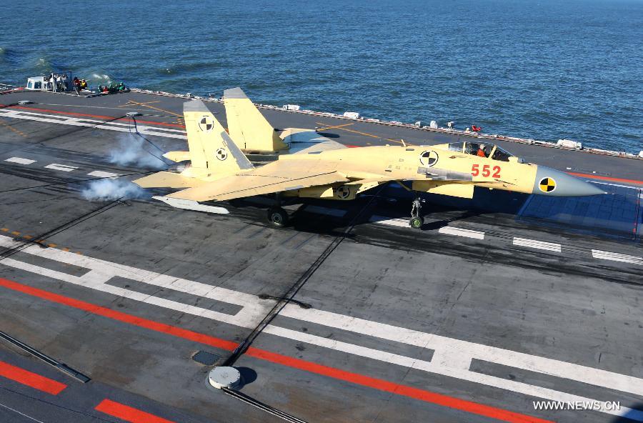 This undated photo shows a carrier-borne J-15 fighter jet landing on China's first aircraft carrier, the Liaoning. (Xinhua/Zha Chunming) 