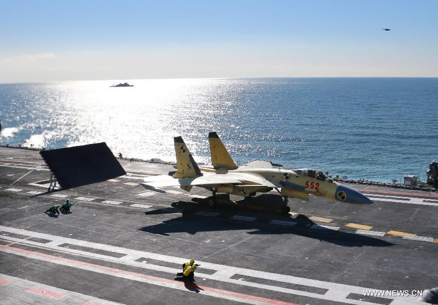 This undated photo shows a carrier-borne J-15 fighter jet ready to take off from China's first aircraft carrier, the Liaoning. (Xinhua/Zha Chunming) 
