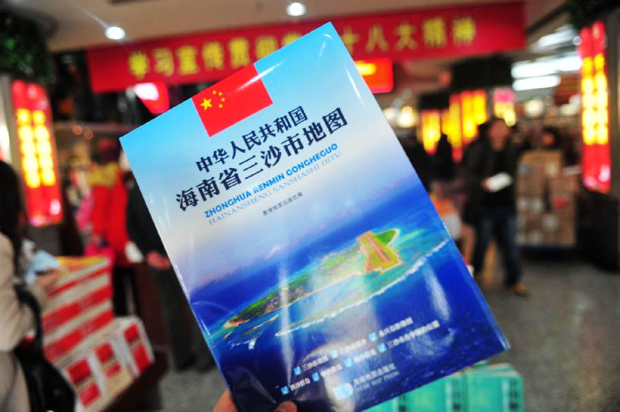 Photo taken on Nov. 24, 2012 shows the map of Sansha city which is for sale at Xidan Books Building in Beijing, capital of China. The first official map of the newly-established Sansha city in south China's Hainan Province was published on Saturday. (Xinhua/Liu Changlong)