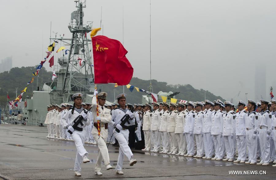 Soldiers of the Chinese People's Liberation Army (PLA) take part in the rotation ceremony at the Stonecutters Island Naval Base in Hong Kong, south China, Nov. 25, 2012. The Chinese PLA garrison troops in the Hong Kong Special Administrative Region (HKSAR) conducted its 15th troop rotation on Sunday since it assumed Hong Kong's defense responsibility on July 1, 1997. (Xinhua/Lui Siu Wai) 