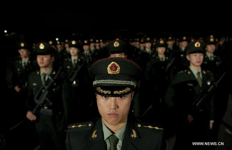 Soldiers of the Chinese People's Liberation Army (PLA) stand in their formation at a barrack during the rotation ceremony in Hong Kong, south China, Nov. 25, 2012. The Chinese PLA garrison troops in the Hong Kong Special Administrative Region (HKSAR) conducted its 15th troop rotation on Sunday since it assumed Hong Kong's defense responsibility on July 1, 1997. (Xinhua/Lui Siu Wai) 