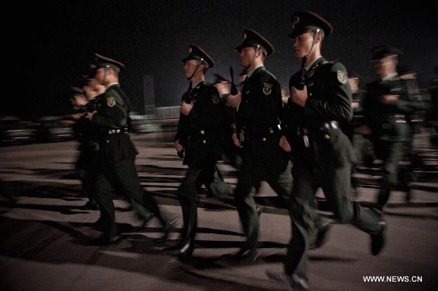 Soldiers of the Chinese People's Liberation Army (PLA) run during the rotation ceremony in Hong Kong, south China, Nov. 25, 2012. The Chinese PLA garrison troops in the Hong Kong Special Administrative Region (HKSAR) conducted its 15th troop rotation on Sunday since it assumed Hong Kong's defense responsibility on July 1, 1997. (Xinhua/Lui Siu Wai) 