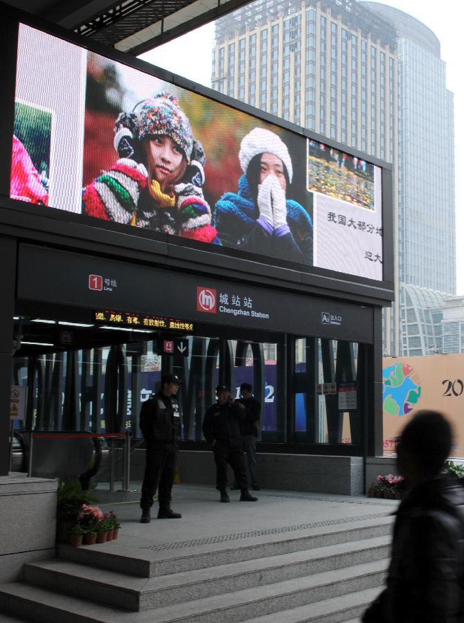 Photos from Xinhua News Agency are seen on the screen of Xinhua Gallery at the newly-built Chengzhan Station of Hangzhou Subway Line 1 in Hangzhou, capital of east China's Zhejiang Province, Nov. 24, 2012. Hangzhou Subway Line 1, the first subway in Zhejiang, was put into a trial operation on Saturday after 5 years of construction.(Xinhua/Wang Xiaochuan) 