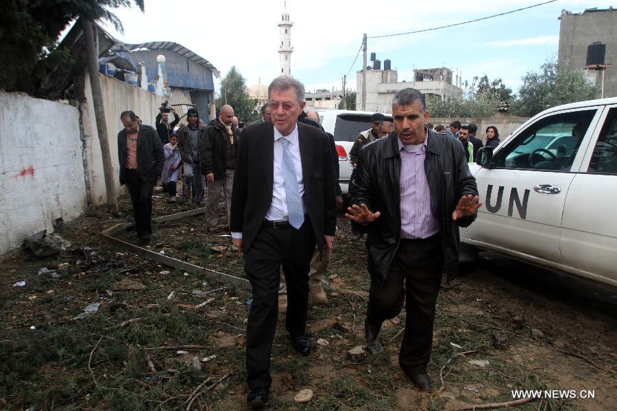 Robert H. Serry (L), the United Nations special coordinator for the Middle East Peace Process, inspects the rubble of a house destroyed in a recent Israeli airstrike during his visit to Gaza Strip in Gaza City on Nov. 25, 2012. (Xinhua/Yasser Qudih) 