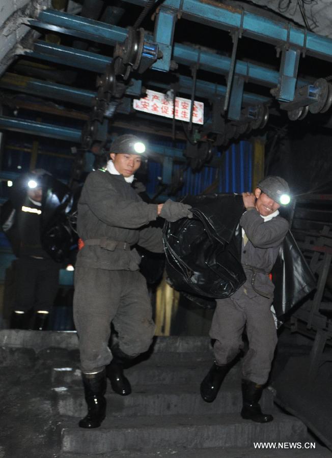 Rescuers work at a coal mine in Panxian County of the coal-rich Liupanshui City, southwest China's Guizhou Province, Nov. 24, 2012. Eighteen miners were killed and five others remain trapped after a gas and coal outburst here on Saturday. (Xinhua/Tao Liang) 