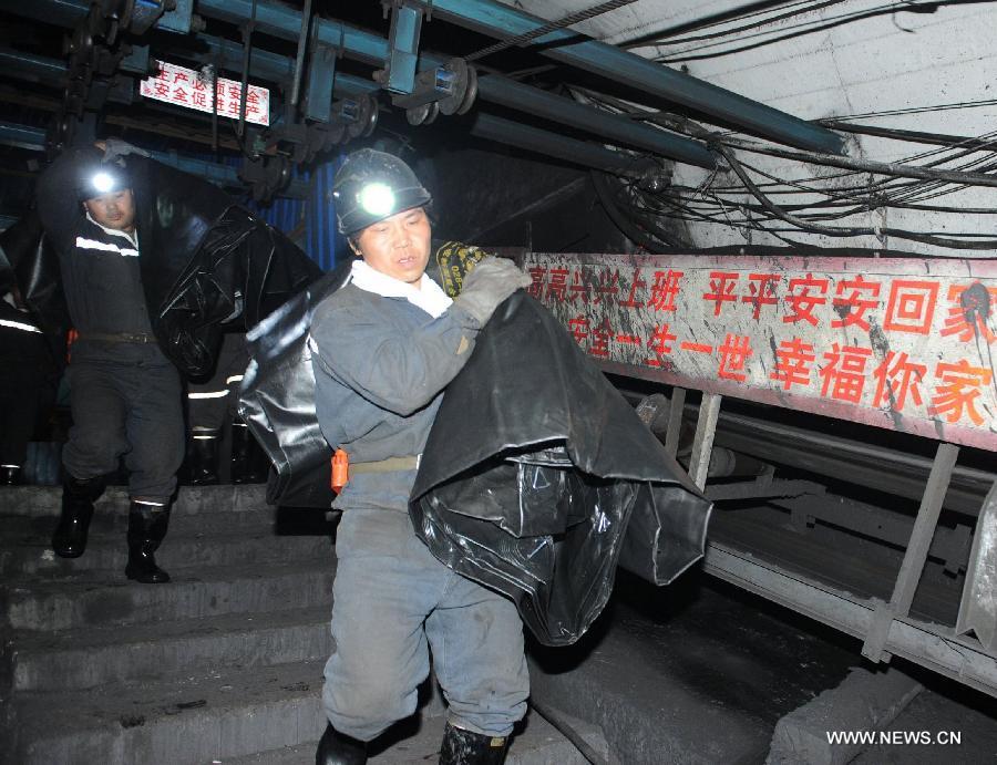 Rescuers work at a coal mine in Panxian County of the coal-rich Liupanshui City, southwest China's Guizhou Province, Nov. 24, 2012. Eighteen miners were killed and five others remain trapped after a gas and coal outburst here on Saturday. (Xinhua/Tao Liang) 