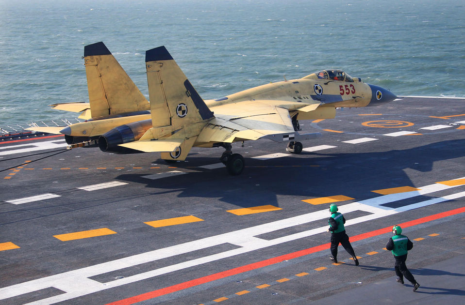 A carrier-borne J-15 fighter jet lands on China's first aircraft carrier, the Liaoning. (Xinhua/Cha Chunming)