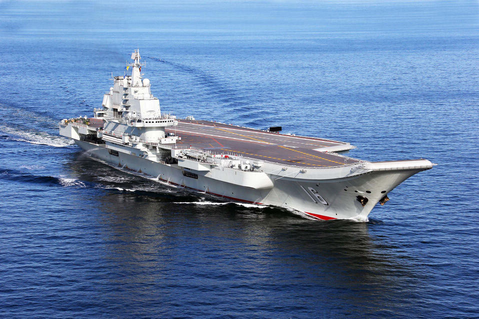 China's first aircraft carrier, the Liaoning, sails on the sea. China has conducted flight landing on its first aircraft carrier.(Xinhua/Cha Chunming)