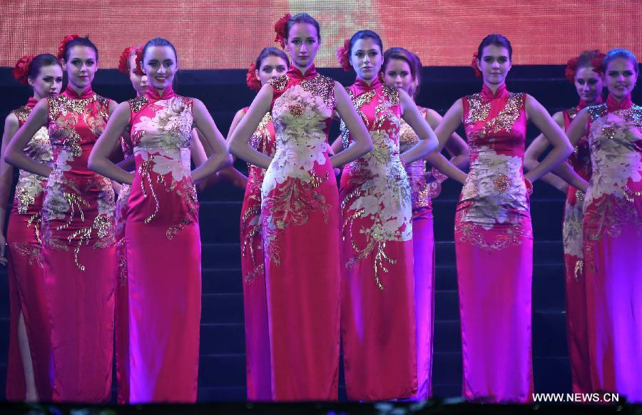 Models present evening dress during the finals of the New Silk Road Miss World Competition in Pu'er, southwest China's Yunnan Province, Nov. 24, 2012. A total of 46 models from across the world competed in the finals of the contest. (Xinhua/Li Mingfang) 