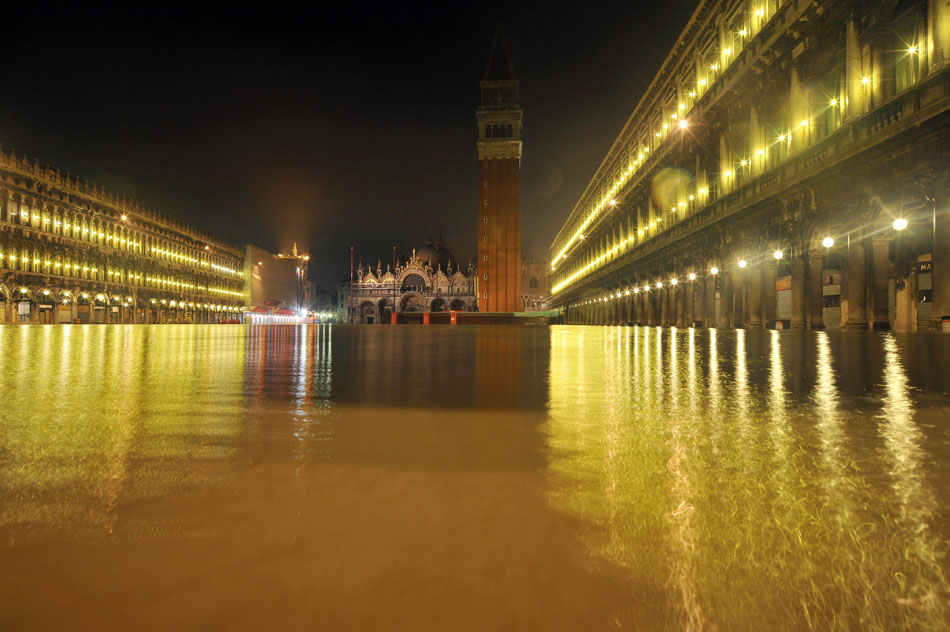 The Plazza San Marco is submerged in ‘The Water City’ Venice on Dec. 23, 2009. Italian meteorologist said floods in Venice will become more frequent due to global warming. (Xinhua/AFP)
