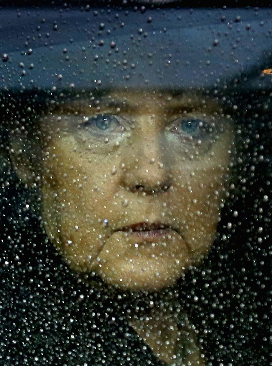 German Chancellor Angela Merkel arrives at the E.U. headquarters in Brussels on Nov. 23, 2012 to attend the EU special summit and discuss E.U.'s medium-term budget during 2014-2020. (Xinhua/Reuters)