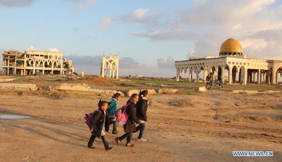 Palestinian students walk past the rubble of the Gaza International Airport in the southern Gaza Strip city of Rafah, on Nov. 25, 2012. (Xinhua/Khaled Omar) 