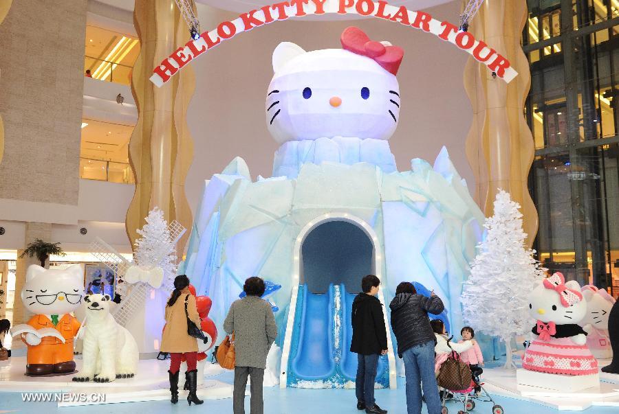 People visit a "Hello Kitty Polar Tour" exhibition in the Joy City in east China's Shanghai Municipality, Nov. 26, 2012. The exhibition themed on Hello Kitty's exploration in the polar regions would last from Nov. 24, 2012 to Feb. 24, 2013 in Shanghai. (Xinhua/Lai Xinlin) 