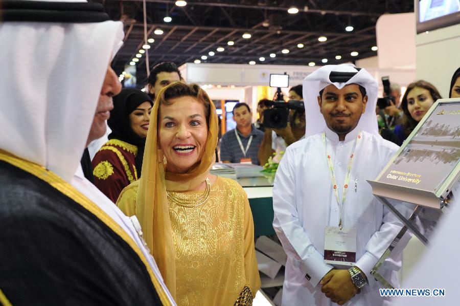 Abdullah bin Hamad Al-Attiyah (L), president of the 18th Conference of the Parties (COP18) to the United Nations Framework Convention on Climate Change (UNFCCC), and UNFCCC Executive Secretary Christiana Figueres (C) inspect the Qatar Sustainability Expo after its opening at the Doha Exhibition Center (DEC) in Doha, Nov. 26, 2012. Qatar Sustainability Expo, a demonstration of various environmentally-friendly technology projects from Qatar and abroad, opened at the DEC on Monday. (Xinhua/Li Muzi) 
