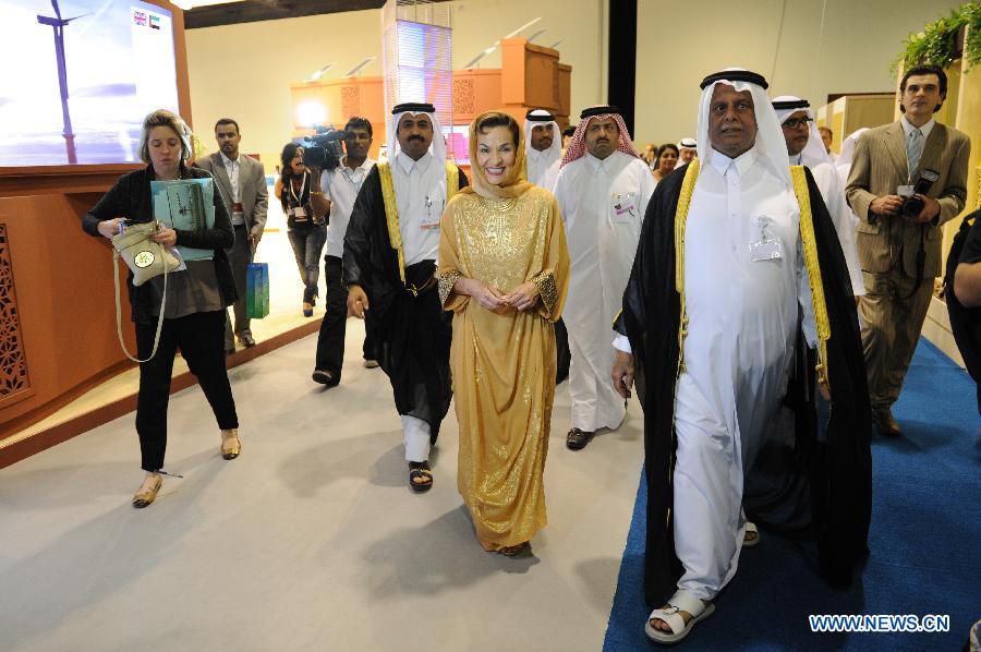 Abdullah bin Hamad Al-Attiyah (1st R), president of the 18th Conference of the Parties (COP18) to the United Nations Framework Convention on Climate Change (UNFCCC), and UNFCCC Executive Secretary Christiana Figueres (C) inspect the Qatar Sustainability Expo after its opening at the Doha Exhibition Center (DEC) in Doha, Nov. 26, 2012. Qatar Sustainability Expo, a demonstration of various environmentally-friendly technology projects from Qatar and abroad, opened at the DEC on Monday. (Xinhua/Li Muzi) 