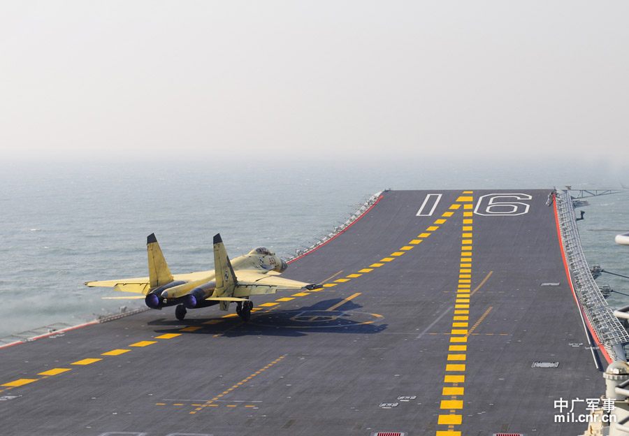 Photo shows carrier-borne J-15 fighter jet taking off from China's first aircraft carrier, the Liaoning. (mil. cnr.cn/ Sun Li)