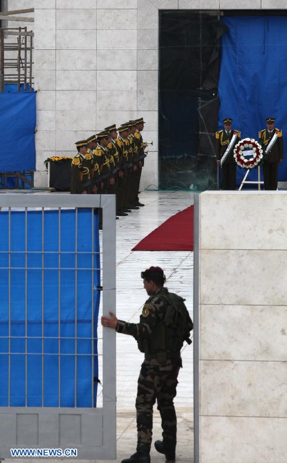 A Palestinian policeman closes the door of the mausoleum housing late Palestinian President Yasser Arafat, in the West Bank city of Ramallah, on Nov. 27, 2012. Earlier Tuesday, the PNA finalized digging up the remains of Arafat, as Russian, Swiss and French experts took samples of the remains to inspect the reason behind his death. (Xinhua/Ayman Nobani)