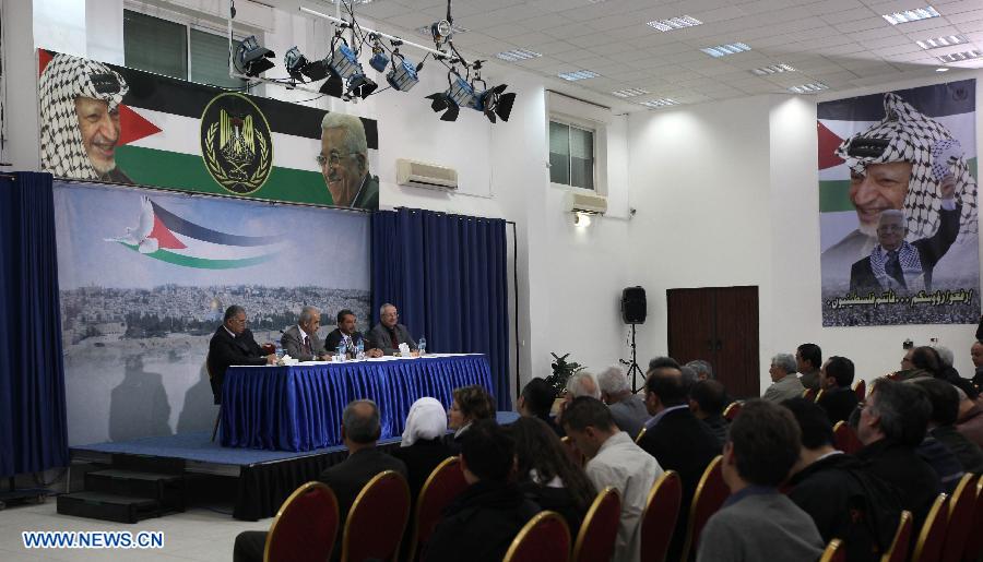 The Palestinian committee to probe the circumstances of Arafat's death holds a press conference in the West Bank City of Ramallah on Nov. 27, 2012. Earlier Tuesday, the Palestinian National Authority (PNA) finalized digging up the remains of Arafat, as Russian, Swiss and French experts took samples of the remains to inspect the reason behind his death. (Xinhua/Ayman Nobani)