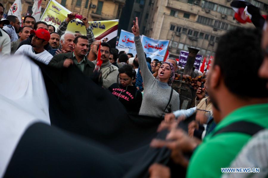 Anti-Mursi protesters gather at Tahrir Square in Cairo, to take part in a one-million-person rally rejecting the new constitutional declaration issued by President Mohamed Morsi on Nov. 27, 2012. (Xinhua/Amru Salahuddien) 