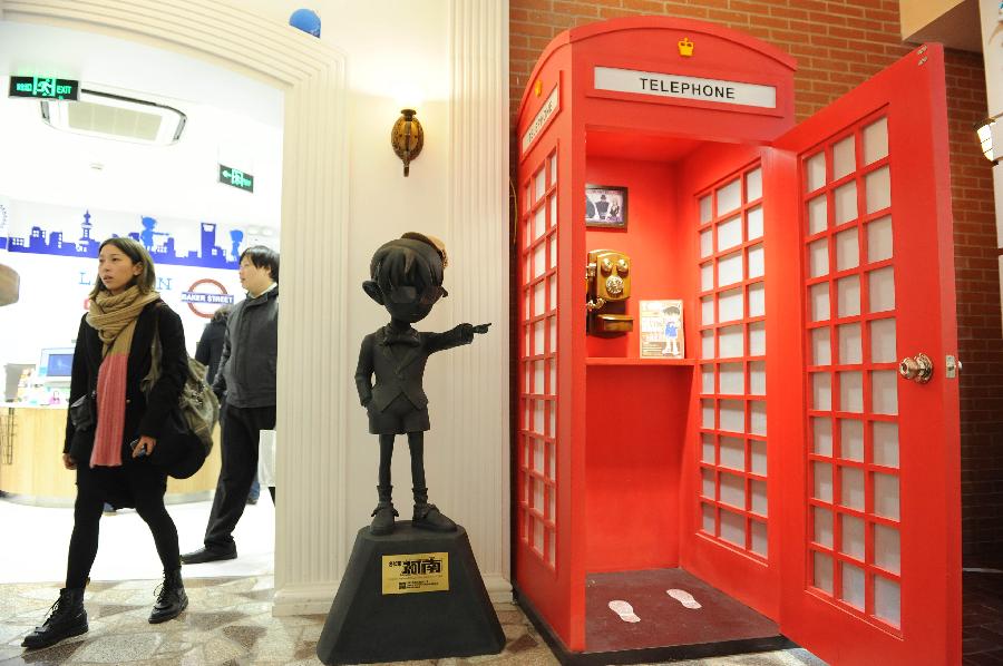 Customers visit Detective-Conan-themed Lawson convenience store in Shanghai, east China, Nov.28, 2012. The store which was designed and constructed according to the scene of the Japanese cartoon Detective Conan, opened to the public in Shanghai on Wednesday. (Xinhua/Lai Xinlin)  