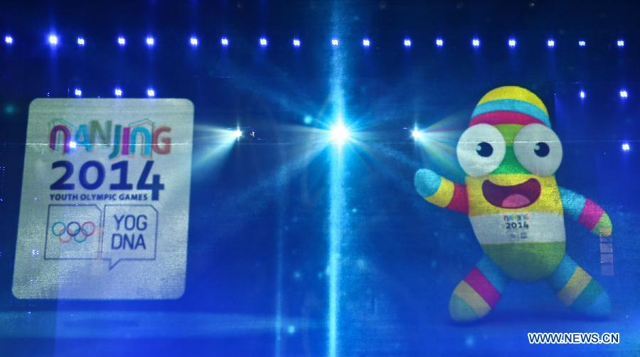 Lele, 2014 Summer Youth Olympics' mascot, is shown on a screen in Nanjing, east China's Jiangsu Province on Nov. 29, 2012. The creature was unveiled as the mascot for the 2014 Summer Youth Olympics here Thursday. (Xinhua/Yang Lei) 
