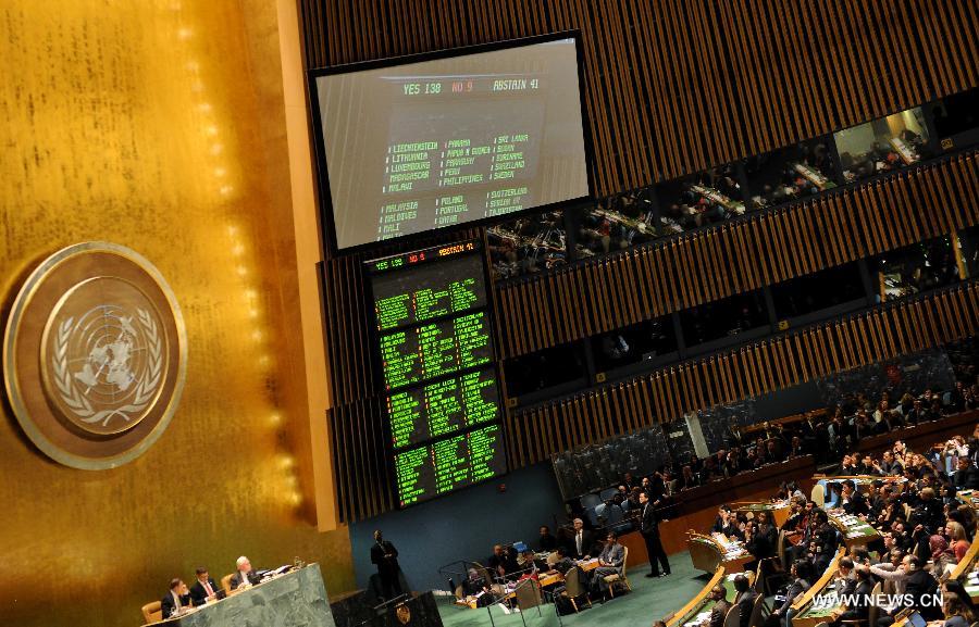 The results of the vote are displayed on the electronic boards during the UN General Assembly (UNGA) meeting at the UN headquarters in New York, the United States, on Nov. 29, 2012.  (Xinhua/Shen Hong)