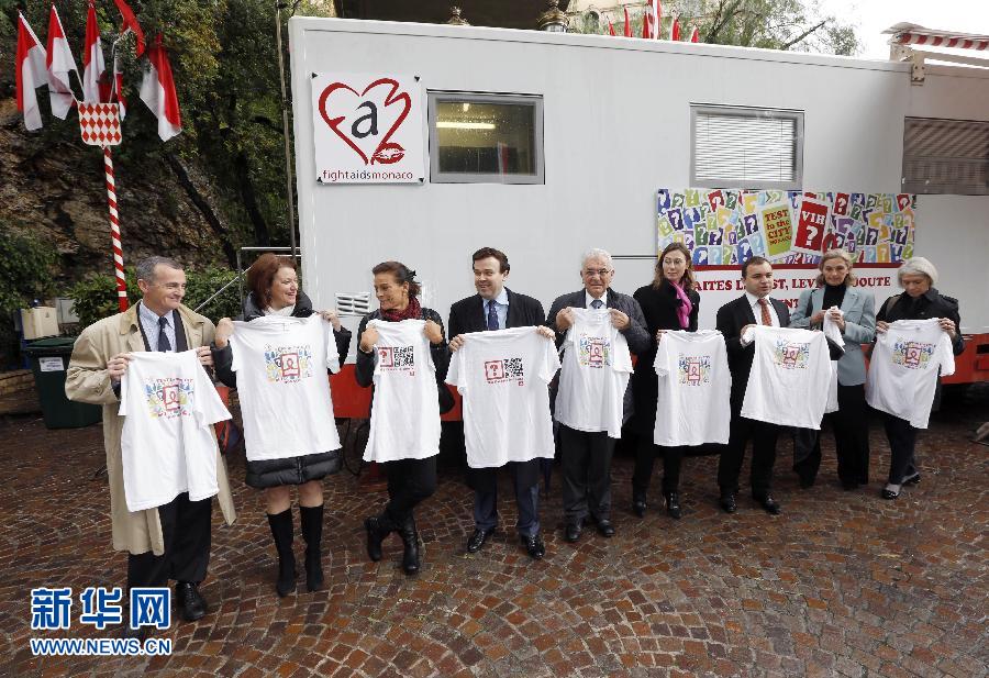 Princess Stephanie of Monaco (R3) and guests show T-shirts with international symbol of AIDS during an activity for the World AIDS Day on Nov. 26, 2012. (Xinhua/AFP)